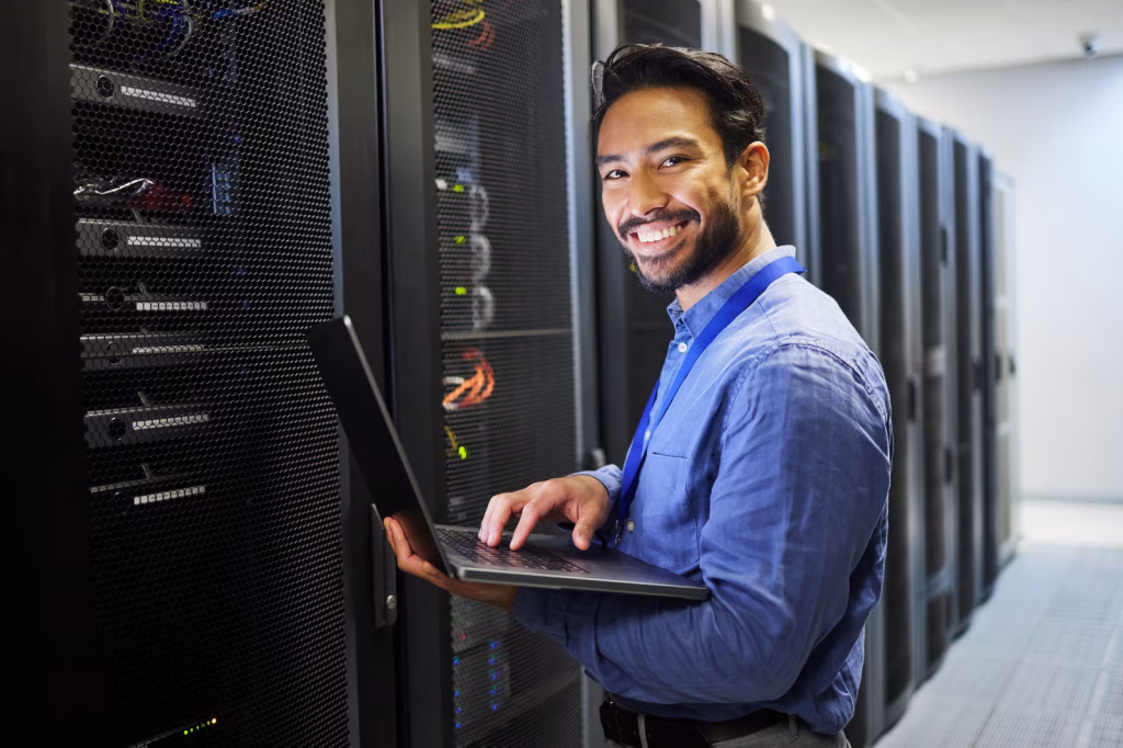 Man, engineering computer and server room, data center and portrait for system solution, electricia