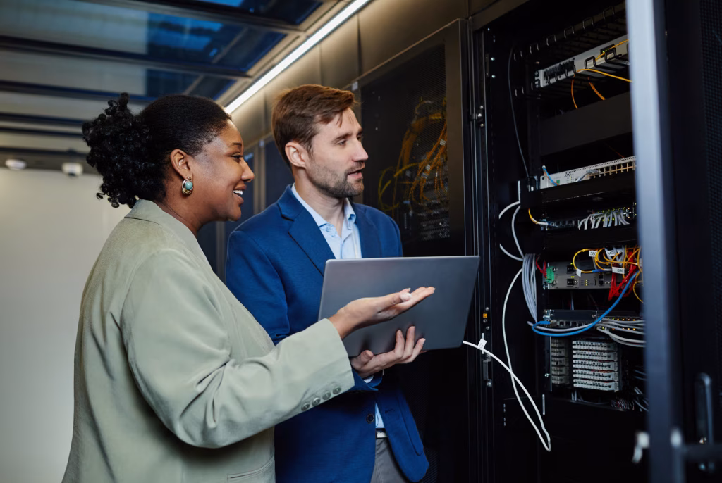 IT Specialists Working with Server Technology in Workplace