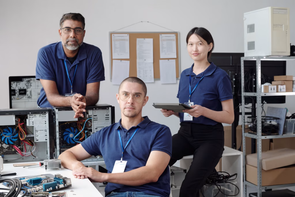 Group of IT Professionals Working on Computers in Office